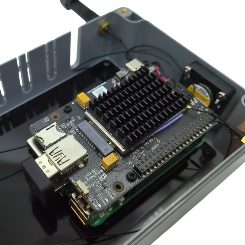 Inside the enclosure: Sixfab 5G HAT v2 with M.2 module heatsink and USB 3.0 bridge connector mounted on the Raspberry Pi