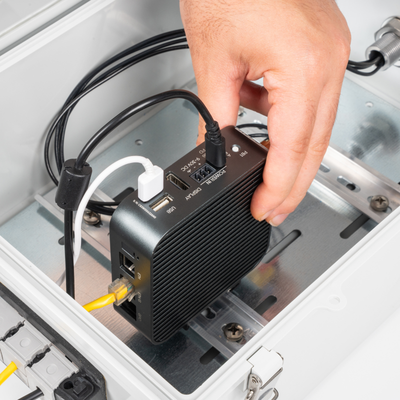 Placing an ALPON edge computer on the DIN rail inside the Sixfab Edge Outdoor Kit